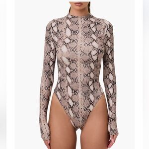 46. Naked wardrobe $78 (current) Naked Snakeskin Print Long Sleeve Bodysuit